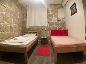 Posteľ alebo postele v izbe v ubytovaní Plaza Stone Apartment