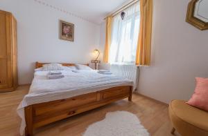 Postel nebo postele na pokoji v ubytování Pension Fialka