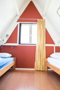 Un pat sau paturi într-o cameră la Bungalow 131