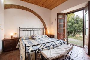 Postel nebo postele na pokoji v ubytování Agriturismo Il Poderuccio