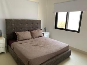 Postel nebo postele na pokoji v ubytování WATERFRONT FLAT + 8 fotografií