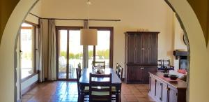 a kitchen with a table and chairs and a dining room at Casa Prana by Cafayate Holiday in Cafayate