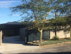 a house with a tree next to a driveway at Ammabed Accommodation in Caledon