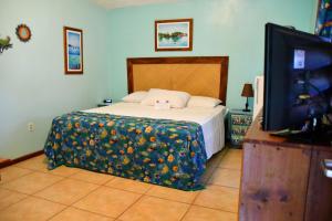 Letto o letti in una camera di West Bay Lodge and Spa