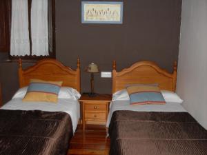 Postel nebo postele na pokoji v ubytování Hotel Asturias