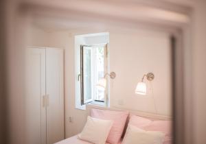 Postel nebo postele na pokoji v ubytování Apartment in Vis historic center - Mikula, Ljubica, Toma