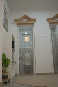 a bathroom with a shower with a toilet in it at Apartment Beganovic-Centar in Kulen Vakuf +64 photos