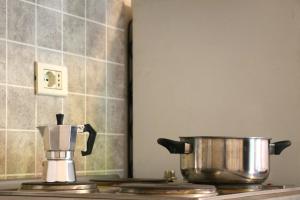 A kitchen or kitchenette at Basement Turati 3 -Consulates District