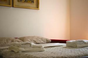 A bed or beds in a room at Basement Turati 3 -Consulates District