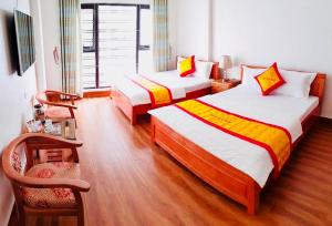 Giường trong phòng chung tại Thanh Hoài Hotel