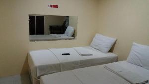 Letto o letti in una camera di Lei Kendee