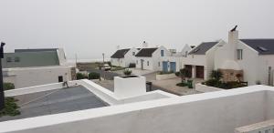 a view of a row of houses from a roof at Pondok in Paternoster