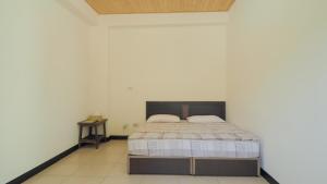 Postel nebo postele na pokoji v ubytování Dongyin Homestay連江縣民宿054號