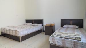 Postel nebo postele na pokoji v ubytování Dongyin Homestay連江縣民宿054號