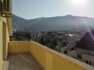 a view of a city from the balcony of a building at Apartments Olga in Tivat