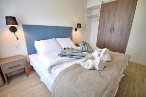 Posteľ alebo postele v izbe v ubytovaní Apartamenty Onyx SeaView by Rent like home