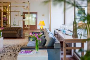 a living room with a couch and a table at St Raphael Resort in Limassol