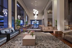 a living room with couches and a lobby at St Raphael Resort in Limassol
