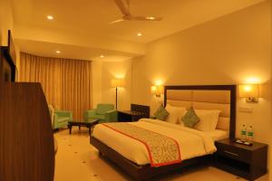 Hotel Natraj Rishikesh客房内的一张或多张床位