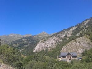 a house on the side of a mountain at Refugi del Fornet in Alós d'Isil