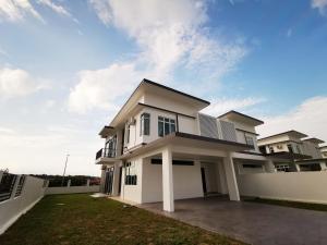 a large white house with a yard at Desaru Homestay by Home Cube in Desaru