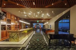 a bar with a ping pong table in a room at St Raphael Resort in Limassol