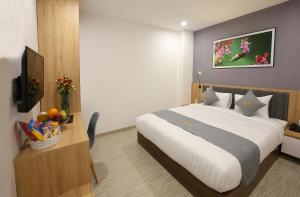 Tempat tidur dalam kamar di Davue Hotel by THG