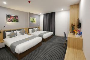 Tempat tidur dalam kamar di Davue Hotel by THG