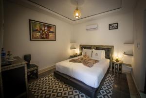 Postel nebo postele na pokoji v ubytování Riad Challa Hotel & Spa