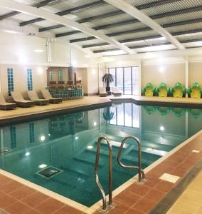 a large swimming pool with a pool at RJ Luxury Caravan Hire With Hot Tub in Tattershall
