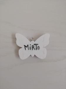 a white butterfly ceiling fan with the word muppet at in campagna da Nino in Olbia
