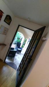 a room with a staircase with chairs and a window at Villa Azur Cap d'Ail in Cap d'Ail