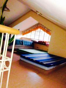 a room with a bunk bed and a window at Tagaytay Budget Transient/ Staycation Home in Tagaytay