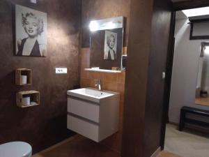a bathroom with a sink and a mirror and a toilet at Villa Azur Cap d'Ail in Cap d'Ail