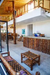 a living room with a table and a counter at Sunlit Hostel in General Luna