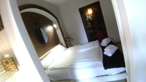 a hotel room with a bed with a mirror at Villa Azur Cap d'Ail in Cap d'Ail