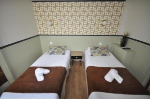 Un ou plusieurs lits dans un hébergement de l'établissement Hotel Cote Basque