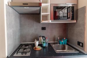 Kuchyň nebo kuchyňský kout v ubytování Hotel Bungalows Europa