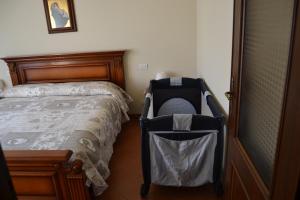 En eller flere senge i et værelse på Villa La Veranda