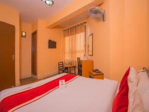 Rúm í herbergi á Hotel Premium