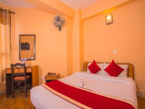 Rúm í herbergi á Hotel Premium