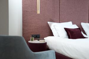 Voodi või voodid majutusasutuse Athenaeum Smart Hotel toas