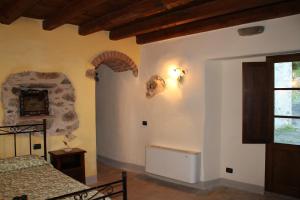 Postel nebo postele na pokoji v ubytování Agriturismo I Chiosi
