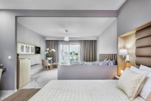 Posteľ alebo postele v izbe v ubytovaní Anna Hotel