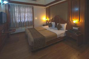 Hotel Ayodhya客房内的一张或多张床位