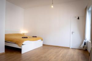 Postel nebo postele na pokoji v ubytování Quartier Leonard