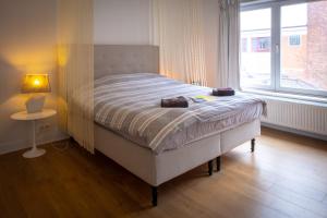 Postel nebo postele na pokoji v ubytování Quartier Leonard