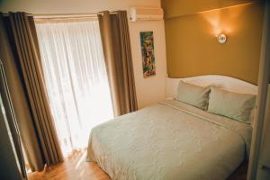 Postel nebo postele na pokoji v ubytování Alaçatı Private Hotel