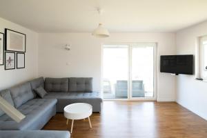 Televízia a/alebo spoločenská miestnosť v ubytovaní Apartamenty.in Jastrzębia Góra