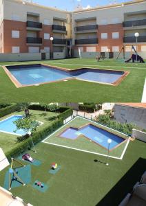 an overhead view of an apartment complex with two swimming pools at Edificio Amanecer in Alcossebre